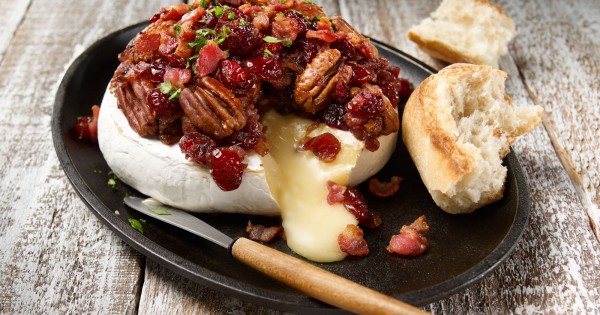 Melted brie with cranberries, bacon and pecans